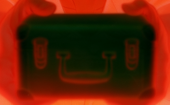 The briefcase prop lock: cropped from the approved frame of shot 16-13
