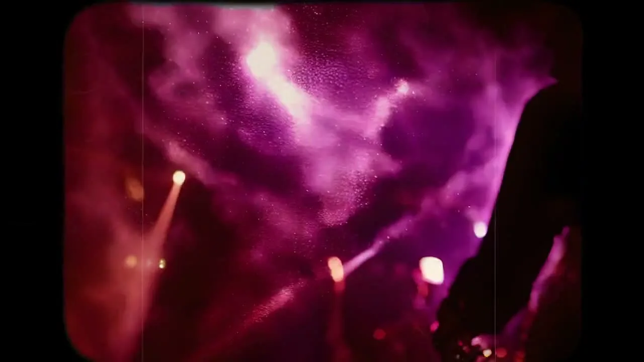 Pink nightclub light and a close face share a layered image with dark silhouettes.